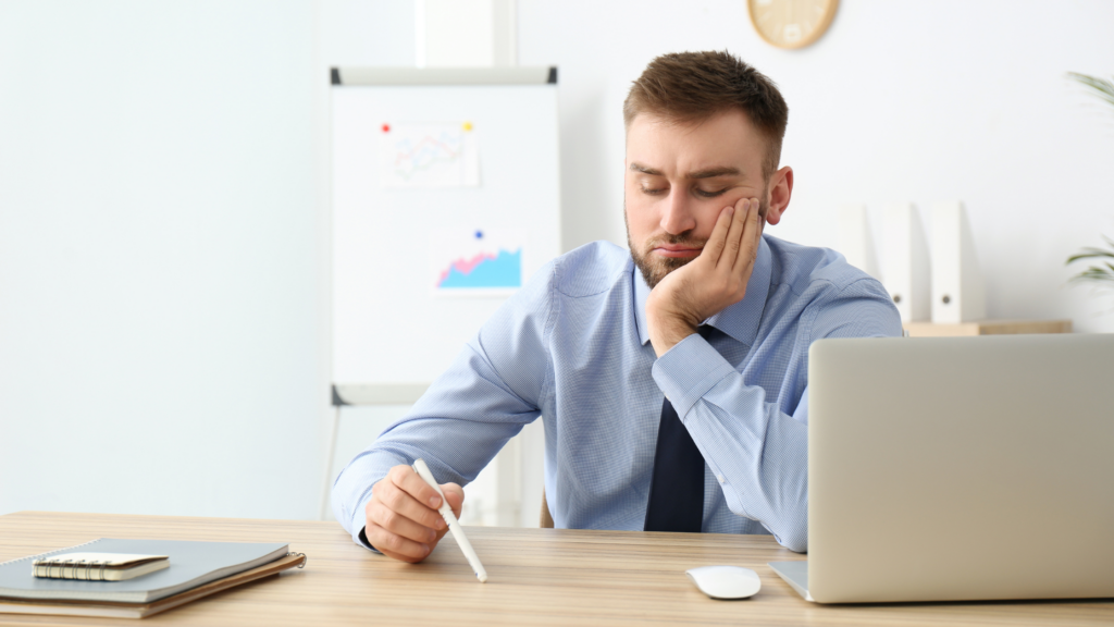 Disengaged employee bored at their desk